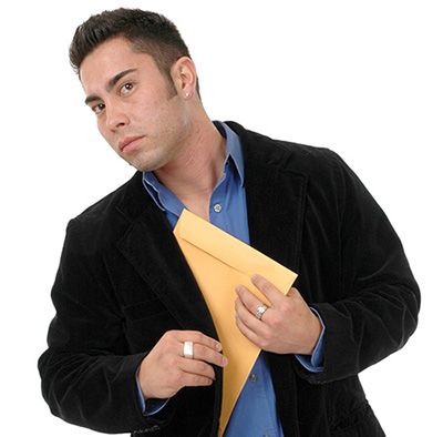man_slipping_confidential_files_into_his_jacket-9a6a4a17 image man slipping confidential files into his jacket