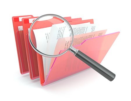 magnifying glass over folders